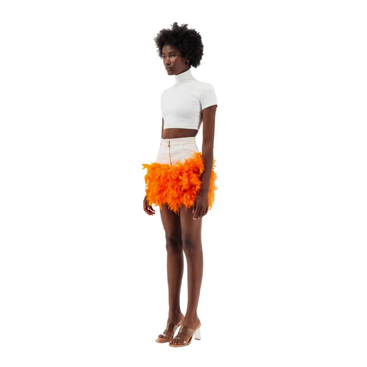 Mini off-white denim skirt with orange feather trim on the hemDetails- Body fit - High waisted - Two front side pockets - Metallic zipper and button closure- Orange feather trim- Hem ends at mid thigh Size & Fit- Refer to our size guide to choose your perfect size - Model height is 180 CM, 5'11- The model is size XXS, wearing a size XXS Care- Hand wash only- Fast dry feathers ( hair dryer does the trick)Composition- Feathers- CottonMade in UAE Chic Feathered Bottoms For Summer, Chic Summer Bottoms With Feathers, Chic Feathered Summer Skirt, Chic Summer Skirt With Feather Trim, Feathered Mini Skirt For Summer, Fitted Feather Mini Skirt, Spring Fitted Feather Skirt, Spring Mini Skirt With Feather Trim, Spring Mini Skirt With Feathers