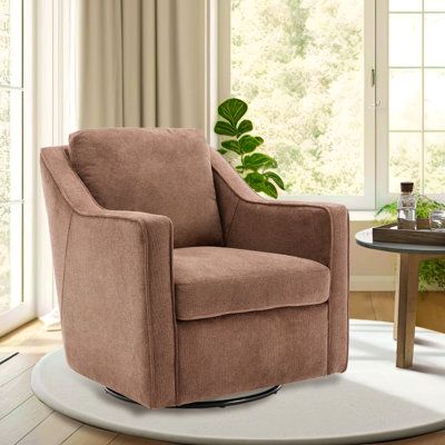 a brown chair sitting on top of a white rug next to a table and window