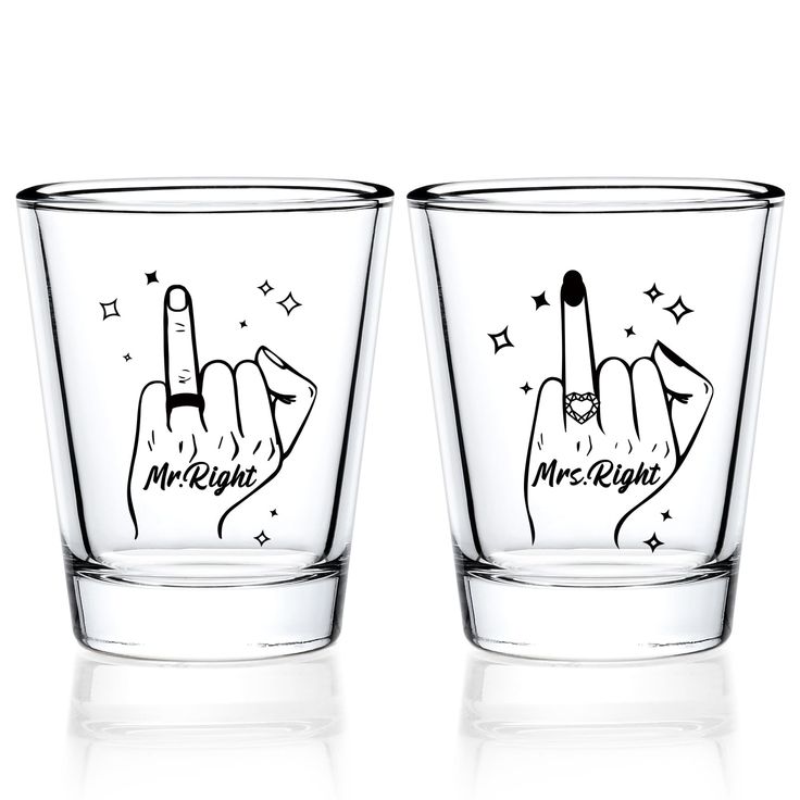 two shot glasses with hand gestures drawn on them