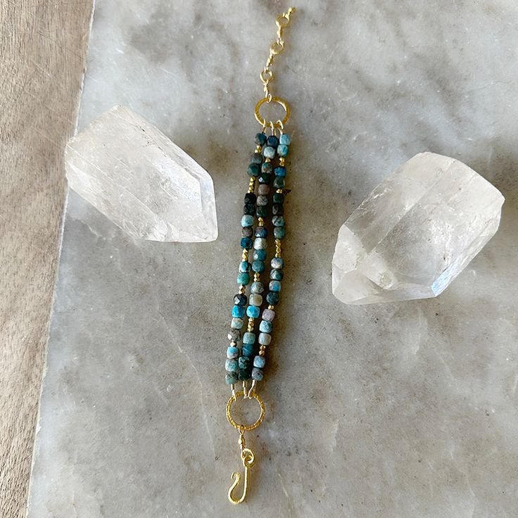 by Robindira Unsworth Handmade at our design studio in California 14k gold vermeil Larimar Length: 6.75" - 7.75" Style No. B571-G Spiritual Chrysocolla Bracelet Jewelry, Hand-strung Labradorite Gold Jewelry, Blue Brass Bracelet, Blue Labradorite Bracelet, Gold Amazonite Bracelet, Gold Amazonite Bracelet Jewelry, Amazonite Bracelet Jewelry In Gold, Artisan Gold Chrysocolla Jewelry, Turquoise Larimar Bracelet