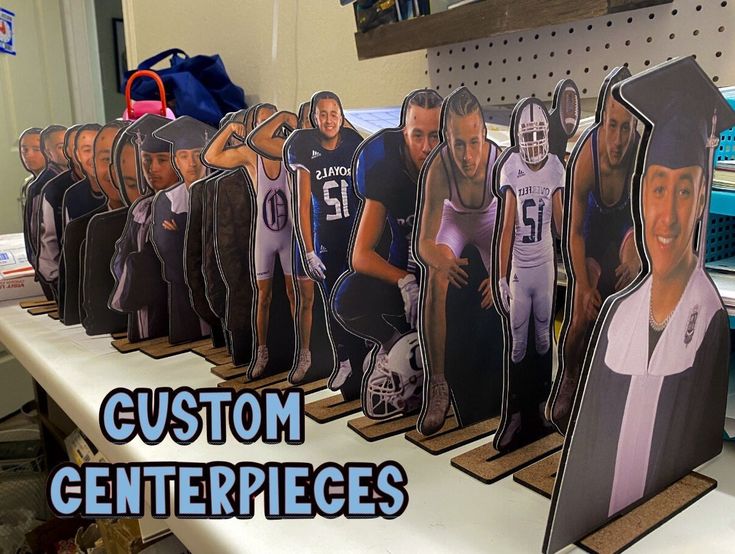 a group of paper cutouts of football players on display in a store with the words custom centerpieces