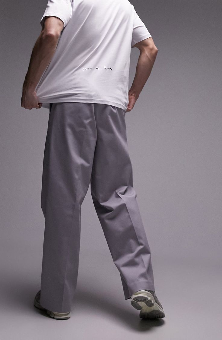 Go for a relaxed fit with your next smart-casual look in these baggy pants cut from a crisp cotton with a hint of stretch. 32" inseam; 20" leg opening; 13" front rise; 16" back rise (size 32) Back elastic waist Side-seam pockets 98% cotton, 2% elastane Machine wash, line dry Imported Classic Cargo Pants For Streetwear With Straight Hem, Classic Cargo Pants With Straight Hem For Streetwear, Classic Straight Hem Cargo Pants For Streetwear, Spring Streetwear Chinos With Tapered Leg, Classic Cargo Pants Relaxed Fit For Streetwear, Spring Streetwear Tapered Leg Chinos, Spring Tapered Leg Chinos For Streetwear, Relaxed Fit Chinos For Streetwear, Straight Leg Chinos For Spring Streetwear