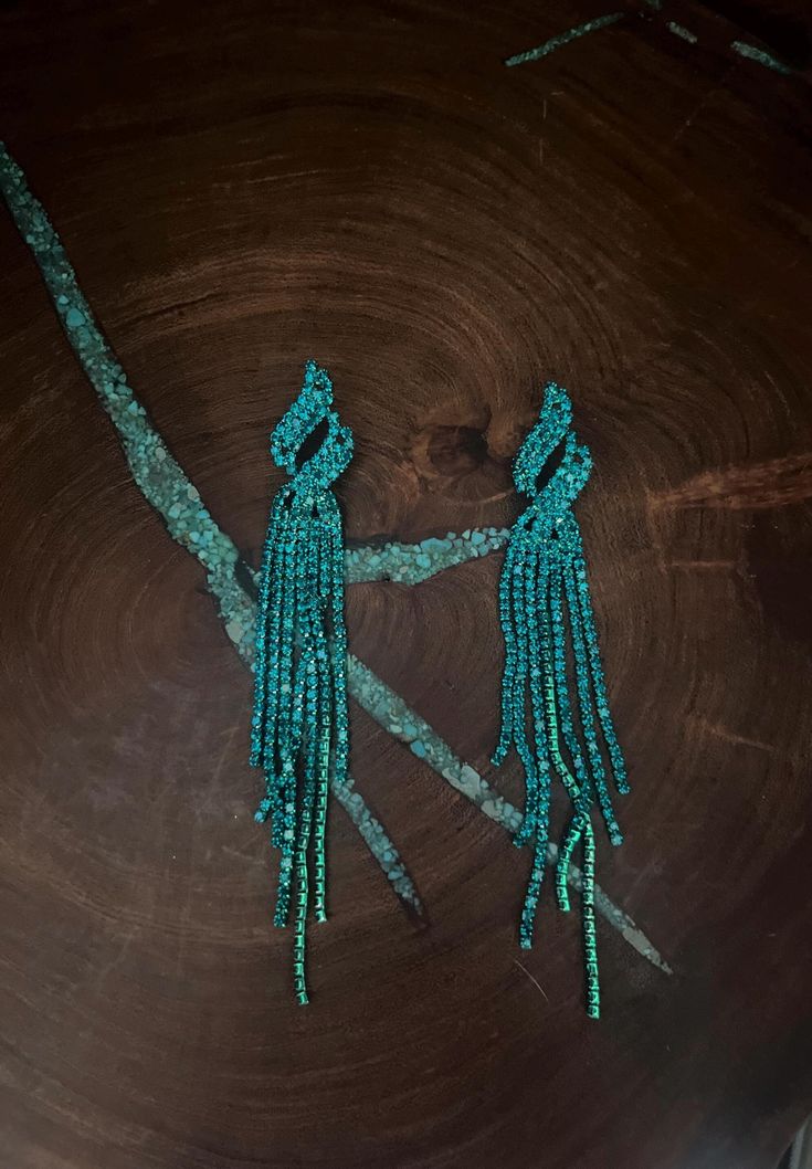 Teal green long fringe earrings  Size: .75 wide by 4 inches long Turquoise Fringe Tassel Drop Earrings, Green Tassel Earrings For Party, Turquoise Earrings For Evening, Green Fringe Tassel Earrings For Party, Green Bohemian Tassel Earrings For Party, Bohemian Green Tassel Earrings For Party, Green Chandelier Drop Earrings, Elegant Green Earrings With Beaded Fringe, Elegant Green Dangle Tassel Earrings