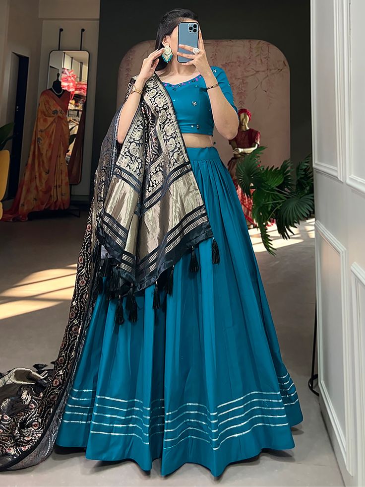 Introducing the precious blue cotton traditional plain lehenga choli with dupatta from Ethnic Plus. This exquisite lehenga choli set is perfect for festivals, events, and special occasions. Made from high-quality blue cotton material, this stunning ensemble features intricate gota patti touch-up work, adding a touch of elegance and sophistication.
The set includes a similar color cotton choli with hand mirror work, enhancing its overall appeal. Additionally, it comes with a black color gaji silk Plain Lehenga Choli, Simple Lehenga Designs, Plain Lehenga, Simple Kurta, 2 Color Combinations, Heavy Lehenga, Simple Lehenga, Cotton Lehenga, Simple Kurta Designs