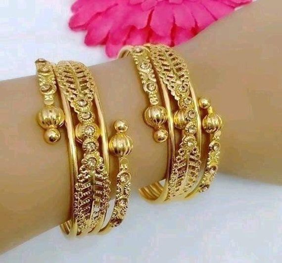 Material:- Brass, Gold Plated Pack-  2 Kada Set These Beautiful Gold Platted Bangles Set Best for gifting and personal use, You can gift your Girlfriend, Mother, Sister , Relatives , Neighbours etc. Combine it with Matching Dress and be the Limelight of every Occasion ( Diwali, Birthday, Anniversary, Christmas, Any Ritual Festival). Suitable for all Occasions. a)These are very skin Friendly. b)The plating is Non- Allergic and safe for all Environment. Gift for Her, Best Friend Gift, Gift Ideas, Valentines Day Gift,Teacher appreciation Gift, Girl Friend Gift, Friendship Gift, Teacher Gift, Mother's day Gift from Daughter, Christmas Gift, Engraved, Gift for Her, Anniversary Gift for Wife, Anniversary Gift for Girlfriend, Valentines Day Gift for Him, Birthday Gift for Him, Graduation Gift for