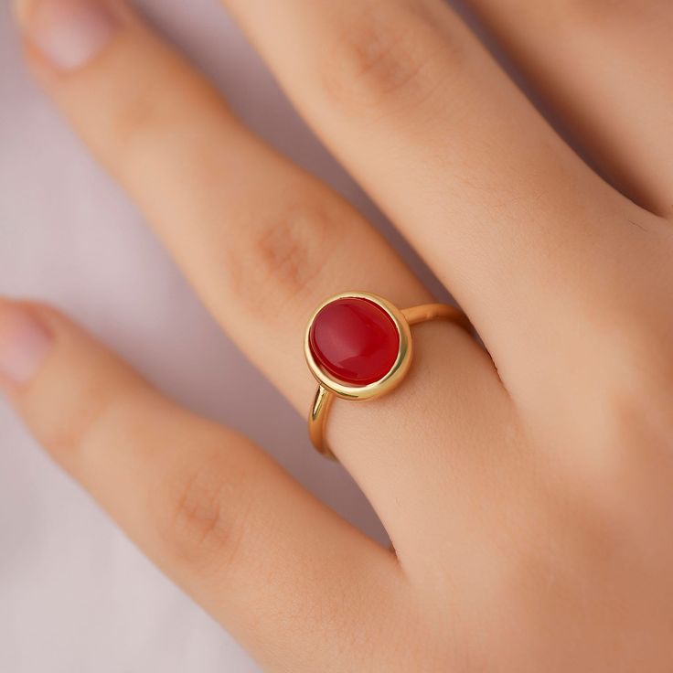 This minimalist garnet ring will be a perfect gift as a christmas for your best friend. Garnet ring with made of gold plated 18 karat .925 sterling silver. The name garnet derives from the Latin word for grain due to the similarity between their rounded crystals and a pomegranate's seeds. Garnet is the official birthstone for January and signifies protection, friendship, trust, commitment, and love. Garnet is also said to keep the wearer safe during travel.Minimalist garnet will be a best gift i Minimalist Birthstone Ring With Bezel Setting For Gift, Minimalist Birthstone Ring With Bezel Setting As A Gift, Minimalist Gift Birthstone Ring With Bezel Setting, Classic Ruby Stackable Rings For Gift, Classic Ruby Stackable Rings As A Gift, Minimalist Bezel Set Stackable Rings Gift, Red Open Ring Stackable Rings For Gift, Red Open Stackable Rings As A Gift, Red Open Stackable Rings For Gift