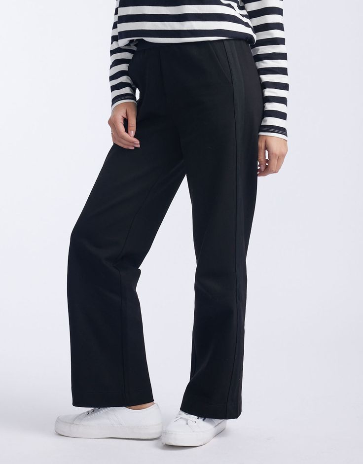 DESCRIPTION Discover the Timeless Straight Leg Ponte Pant, a wardrobe essential from White & Co. that promises comfort and style for any setting. Crafted in classic black, these pants offer a flattering, relaxed fit and showcase a subtle yet chic black tape down the sides. The perfect versatile work-to-weekend piece, they pair beautifully with a crisp white tee and classic blazer for a monochromatic look, or add a pop of colour with a patterned blouse for an effortless transition from day to nig Versatile Full-length Sweatpants For Work, Black Wide Leg Workwear Pants With Straight Hem, Black Wide Leg Pants For Work With Straight Hem, Black Sweatpants With Pockets And Straight Hem, Classic Relaxed Fit Sweatpants With Straight Hem, Classic Straight Leg Sweatpants With Elastic Waistband, Classic Sweatpants With Relaxed Fit And Straight Hem, Classic Black Bottoms With Straight Hem, Classic Black Straight Leg Pants