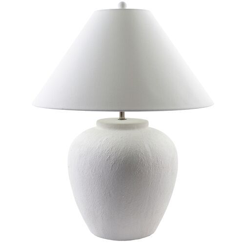 a white table lamp with a white shade on the base and a white fabric lampshade