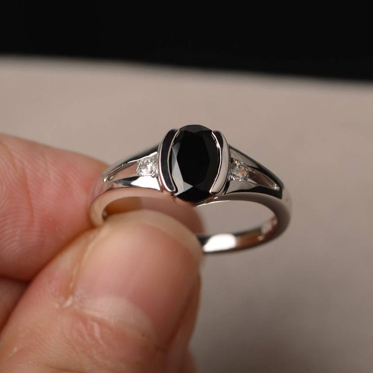 This is a gorgeous handmade creation. Its beauty is its simplicity & Elegance. The 6*8mm oval shape faceted natural black spinel is crafted in solid sterling silver and with rhodium plated. All item is sent in a beautiful gift box If you have any idea of design your ring,pls contact me directly. You can realize more lovely stuff clicking the link https://www.etsy.com/shop/knightjewelry?refshopsection_shophome_leftnav Please leave the correct address and you phone number for delivering succes Black Oval Sapphire Promise Ring, Classic Black Sapphire Oval Ring, Classic Black Oval Sapphire Ring, Elegant Oval Black Spinel Rings, Black Sapphire Ring With Polished Finish For Anniversary, Anniversary Black Sapphire Ring With Polished Finish, Classic Oval Black Spinel Jewelry, Classic Black Sapphire Ring In Sterling Silver, Oval Black Birthstone Jewelry