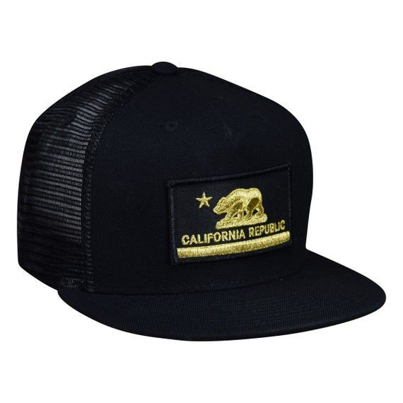 California Republic Trucker Hat by LET'S BE IRIE - Black and Gold, Curved BillHigh qualityComfortableOne size fits mostAdjustable snap backVisit our Etsy shop to find more patches, pins, decals, and more!  https://www.etsy.com/shop/patchparlor Trucker Snapback Hat With Patches, Trucker Snapback Hat With Patches For Streetwear, Trucker Style Snapback Hat With Patches For Streetwear, Trucker Snapback Hat With Patches And Curved Bill, Black Snapback Trucker Hat With Patches, Trucker Fitted Hat With Logo Patch And Curved Bill, Snapback Hats With Patches For Streetwear, Urban Trucker Hat With Logo Patch, Urban Trucker Hat With Logo Patch And Flat Bill