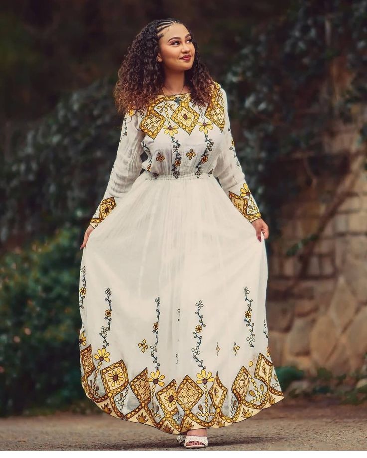 Modern Ethiopian Wedding Dress Habesha Dress Handwoven Habesha Kemis Modern Habesha Libs Eritrean Dress ሀበሻ ቀሚስ ሀበሻ ልብስ Traditional Gold Embroidered Dress With Resham Embroidery, Traditional Gold Embroidered Festive Dress, Traditional Ceremonies Gown With Pallu And Long Sleeves, Traditional Long Sleeve Gown With Pallu, Ceremonial Saree Dress With Intricate Embroidery, Traditional Floor-length Embroidered Dress For Transitional Season, Gold Embroidered Dresses For Traditional Ceremonies And Festivals, Navratri Traditional Long Sleeve Wear With Gold Embroidery, Gold Dress With Traditional Patterns For Wedding