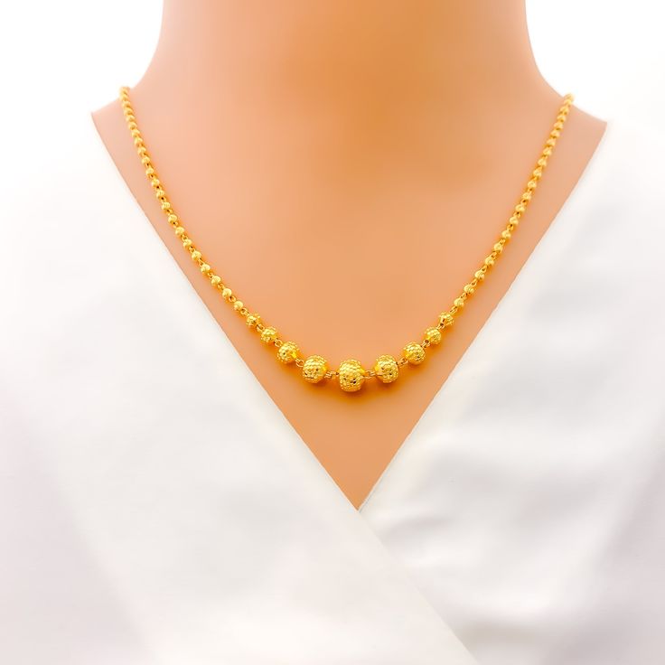 This exquisite 22k gold Lara necklace set, weighing 18.6 grams, features a radiant yellow gold finish and a captivating disco orb design. The necklace measures 20 inches in length, with adjustable 0.6-inch links for a perfect fit. The set includes matching earrings, each 1.5 inches long with screw back posts and detachable hanging elements. Secured with a hook lock, this set is ideal for those who appreciate unique and dazzling jewelry, combining timeless beauty with a twinkling motif, making it Yellow 22k Gold Round Necklace, 22k Gold Yellow Necklace With Round Pendant, Yellow 22k Gold Necklace With Round Pendant, Festive Yellow Round Necklace, 22k Gold Round Beads Yellow Necklace, Yellow 22k Gold Necklaces With Round Beads, 22k Yellow Gold Round Beads Necklace, Yellow 22k Gold Necklace With Round Beads, Dazzling Jewelry