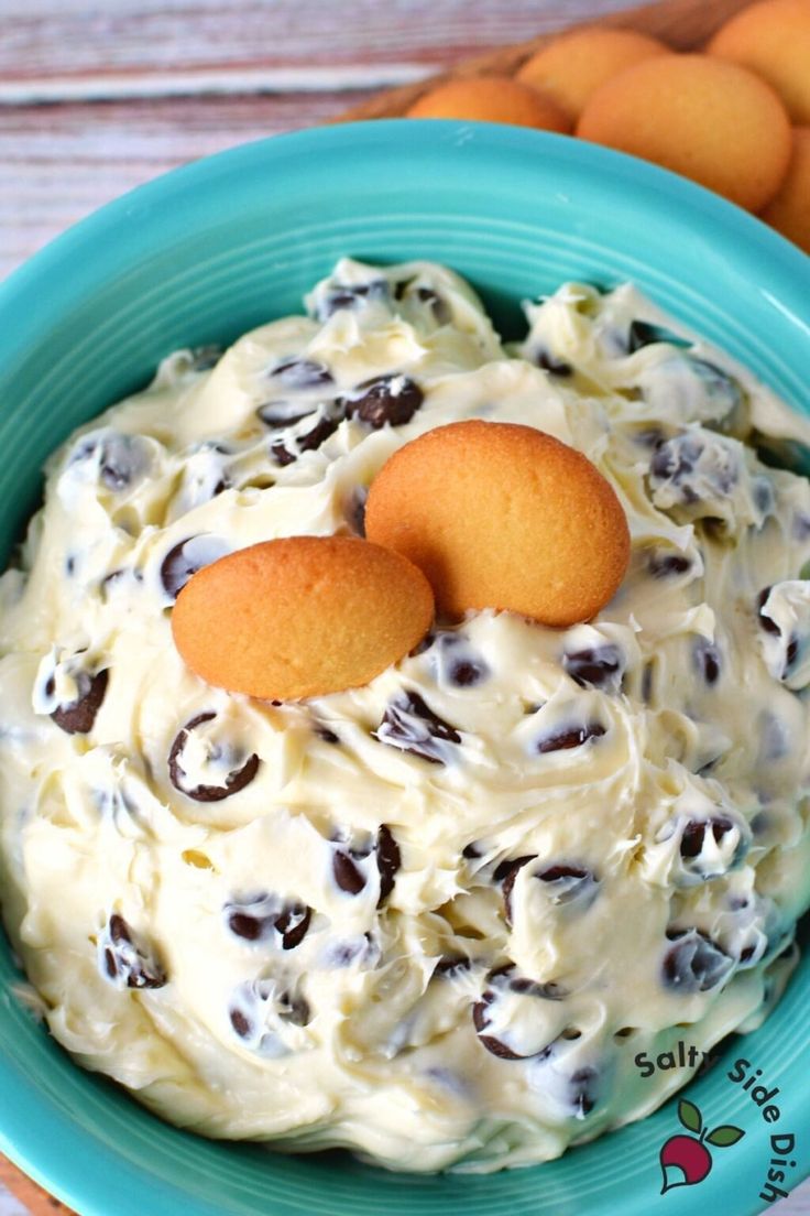 two cookies sitting on top of a bowl of food