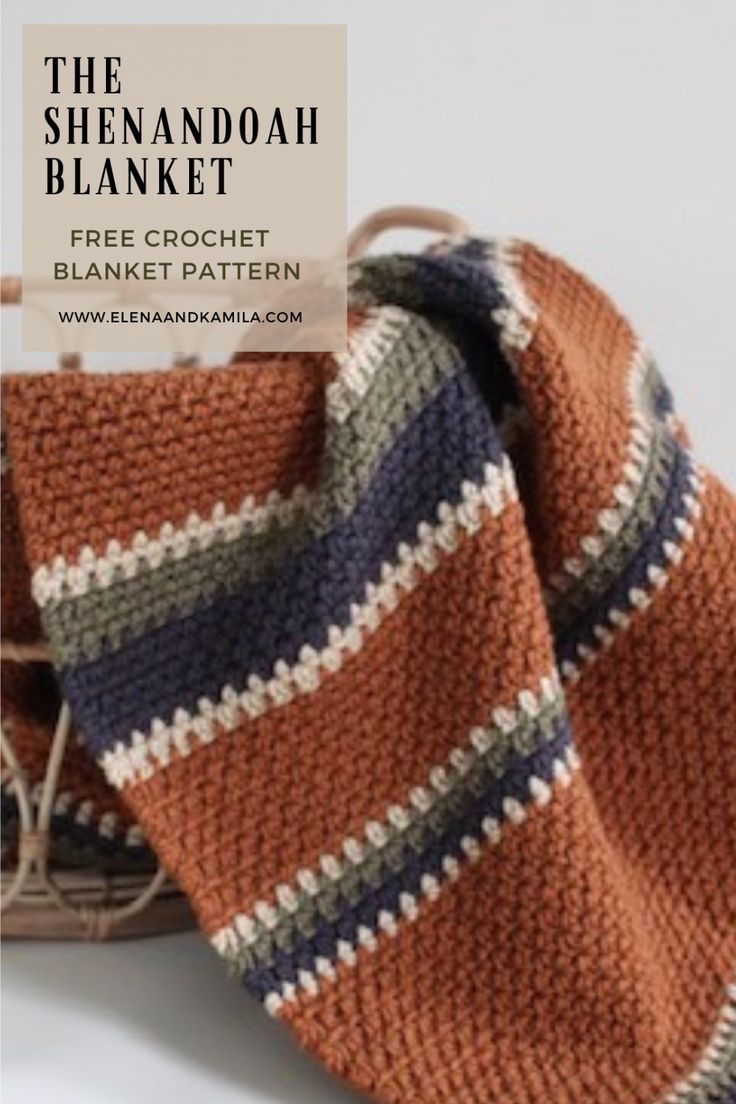 an orange and blue striped blanket next to a basket