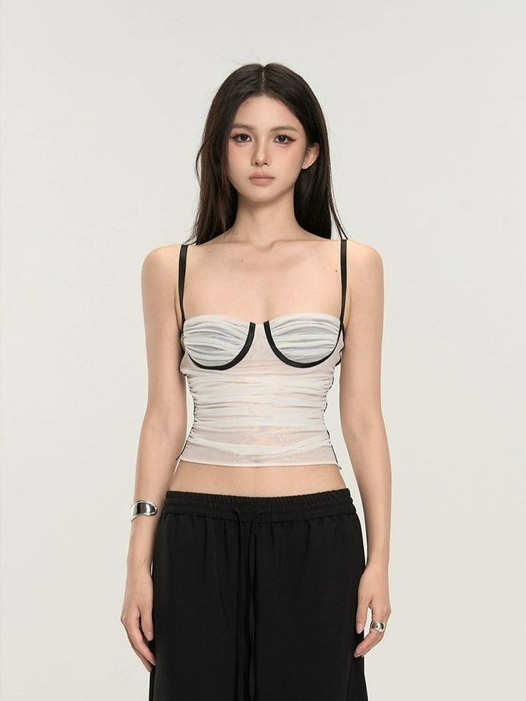 Embrace the mix of simplicity and allure with our Ruched Bustier Crop Top with Slim Straps. 

Its fitted silhouette and structured design offer a chic street-style edge. Crafted with a focus on texture, this crop top features delicate ruching that accentuates your shape, while the solid color design maintains a versatile and sophisticated look. The slim straps and bustier-style bodice are not just design elements; they provide support and enable a fit that's both flattering and comfortable. 

Wh Trendy Crop Top Corset With Built-in Bra, Chic Cropped Tube Top With Boned Bodice, Chic Summer Crop Top With Boned Bodice, Chic Cropped Corset With Built-in Bra, Chic Boned Bodice Crop Top For Summer, Stretch Boned Bodice Crop Top, Trendy Fitted Tube Top With Straps, Bandeau Crop Top With Boned Bodice, Fitted Cropped Tube Top