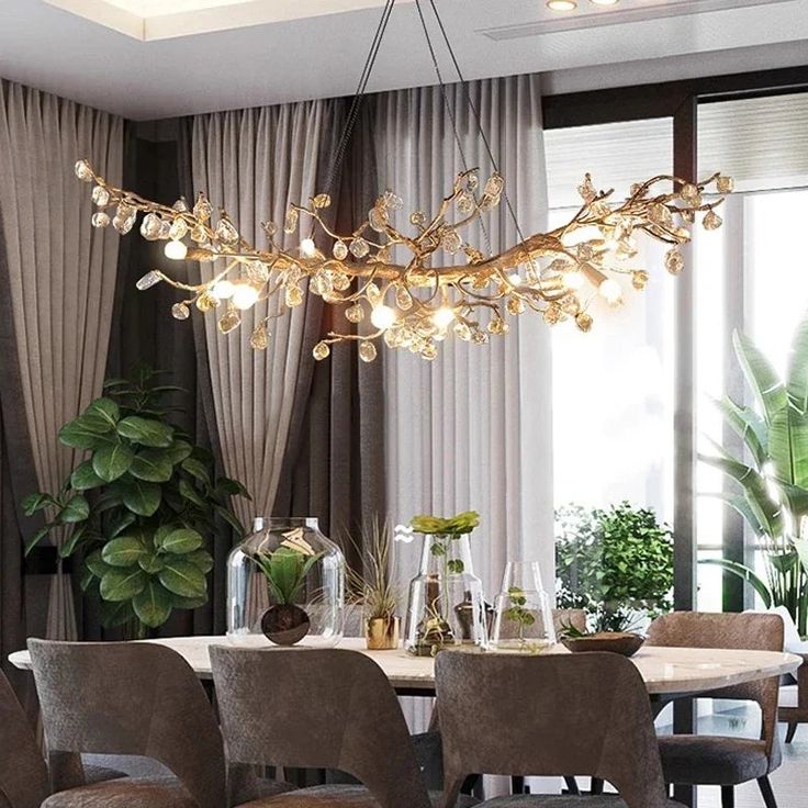 a dining room table with chairs and a chandelier hanging from it's ceiling