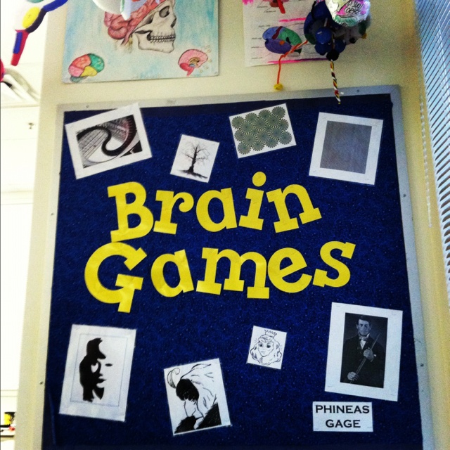 a bulletin board with the words brain games written on it and pictures pinned to it