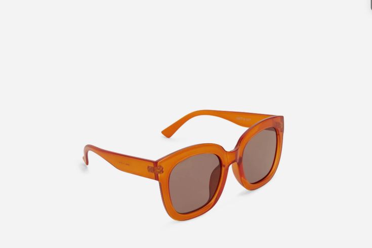 Wide orange sunglasses with transparent orange sunglass frame and brown polarized lenses by sustainable brand Matt & Nat. Chunky orange sunglasses with brown lenses, made with recycled materials. These orange sunnies will be your new everyday essential with their wide frames and transparent orange frames making them perfect for every occasion. 100% UV protection. Comes with a black recycled cleaning cloth and a black recycled PVB sunglasses pouch. Dimensions of sunglasses: 2.25 inches-5.8 inches Orange Sunglasses, Sunglasses Pouch, Matt & Nat, Shoe Boutique, Sustainable Brand, Polarized Lenses, Women's Sunglasses, Sunglass Frames, Cleaning Cloth