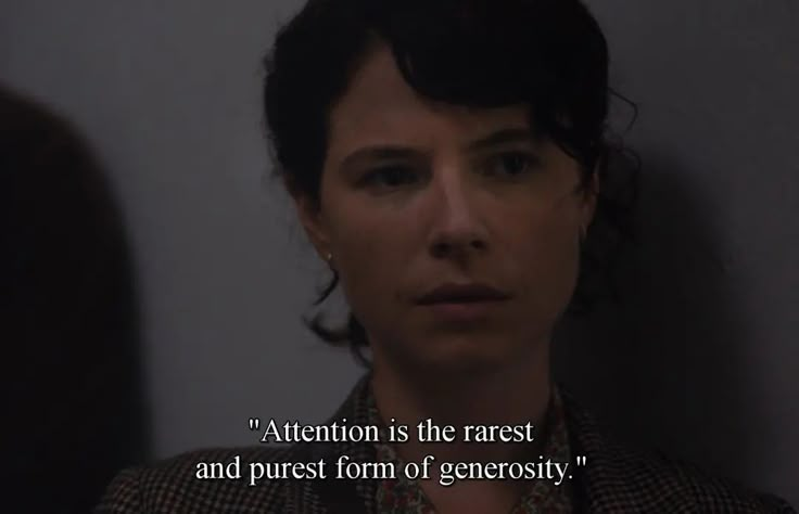 a woman with short black hair and a quote on her face that says, attention is the rarest and purest form of geneosity