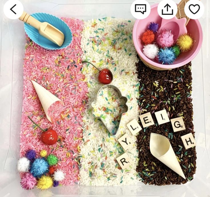 a plastic tray filled with different types of food and letters that spell out the word ice cream