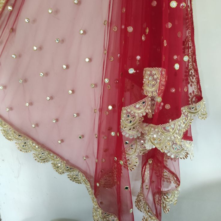 More dupatta here in our collection https://www.etsy.com/shop/neelcreations/?section_id=15880219 Net with embroidery Indian dupatta. It has beautiful golden border. Scallop border with dull gold color. ★ The mirror on all over net is not real. ★ It can be made in other colors and longer in length also. We can also change the border if you want. Approximate length 95 inches. We can increase length so please contact us if you want longer dupatta. These designer dupattas are very much in trend. Pai Red Saree With Sheer Dupatta And Kundan Material, Red Kundan Saree With Sheer Dupatta, Party Dupatta With Dabka Work In Dola Silk, Dabka Work Net Lehenga In Traditional Drape, Dabka Work Net Lehenga, Party Dola Silk Dupatta With Dabka Work, Bollywood Dupatta With Dabka Work For Wedding, Party Dabka Work Dola Silk Dupatta, Traditional Draped Nida Sharara With Dupatta