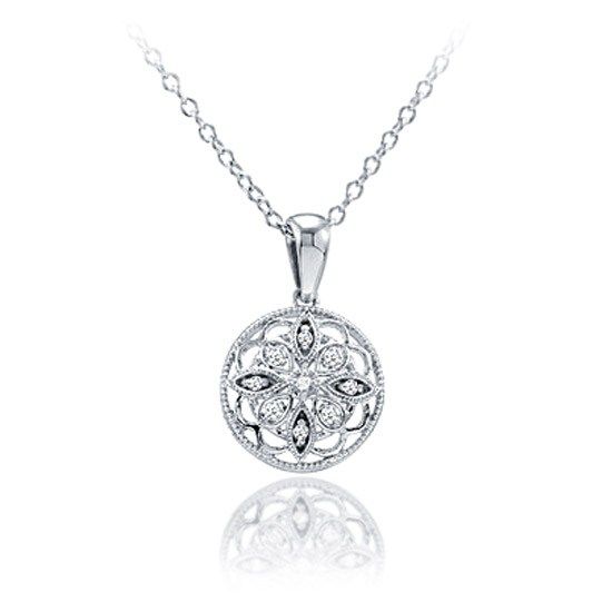 You'll adore wearing this round Sterling Silver and diamond pendant daily. The delicate filigree work describes a starburst motif, with nine sparkling diamonds adorning the points of the star. The G-H color, I2 clarity diamonds total 0.05cttw. An 18 cable chain is included. Luxury Sterling Silver Necklace With Round Diamond, Exquisite Silver Round Cut Diamond Necklace, Intricate Round Diamond Necklace, Fine Jewelry Diamond Necklace With Intricate Design, Round Diamond Necklace With Intricate Design, Diamond White Necklace With Intricate Design, Round Rose Cut Diamond Necklace, Gift Diamond Necklace With Intricate Design, Classic Diamond Necklace With Filigree