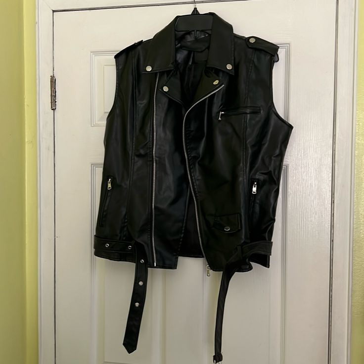 Never Worn, Just Took Out Of The Packaging To Try It On. Very Nice And Stylish. Perfect Outfit For Leather Pride Events. Check Out The Photos. Fitted Vest For Fall Concert, Rocker Sleeveless Vest For Concerts, Rocker Style Sleeveless Vest For Concerts, Sleeveless Rocker Vest For Concerts, Punk Sleeveless Outerwear For Fall, Black Sleeveless Punk Outerwear, Sleeveless Black Punk Outerwear, Spring Biker Vest In Black, Spring Black Biker Vest