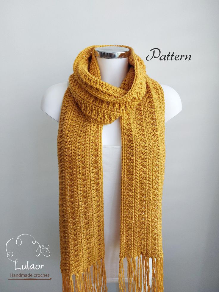 a yellow knitted scarf with fringes