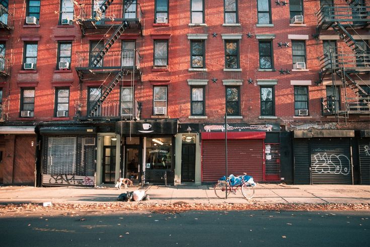 an apartment building with fire escapes on the side