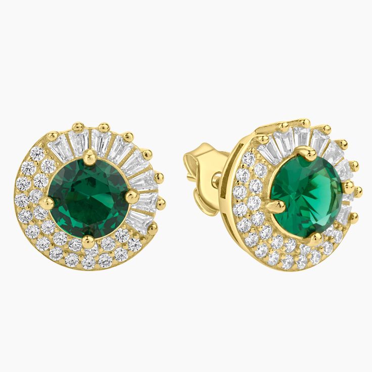 Step into a world of elegance with our Emerald Twilight Halo Stud Earrings, a harmonious fusion of distinctive shapes and mesmerizing sparkle. Carefully crafted in gold-plated sterling silver, these studs house a stunning green spinel at the center. This gem is surrounded by a uniquely designed halo, combining cubic zirconia baguettes on one half and a double row of round CZs on the other. Evoking the captivating allure of twilight, these earrings add an impressive touch of sophistication to any Luxury Green Earrings With Prong Setting, Green Luxury Earrings With Prong Setting, Elegant Green Jewelry With Halo Design, Elegant Green Jewelry With Halo, Elegant Green Halo Jewelry, Green Prong Setting Earrings In Fine Jewelry Style, Green Emerald Jewelry With Halo Detail, Green Emerald Halo Jewelry, Gold Halo Design Jewelry For May Birthstone