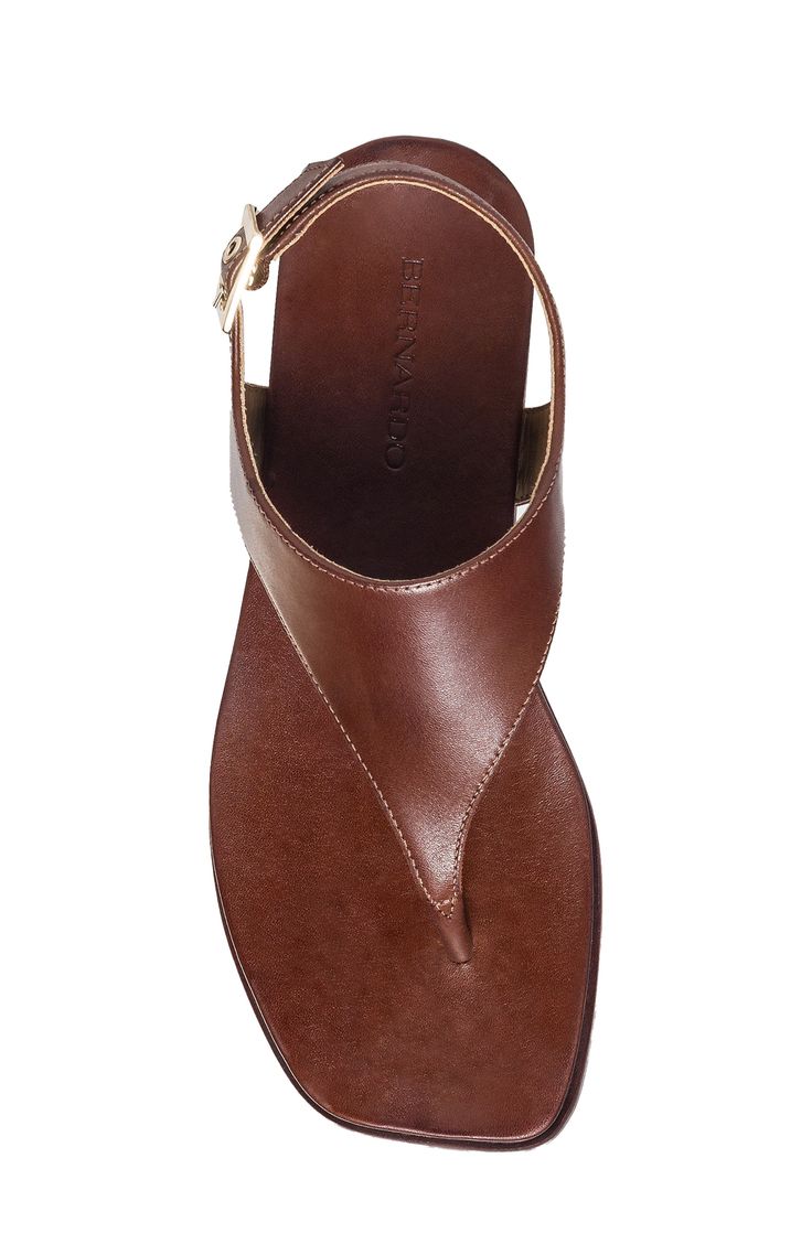 A rich leather upper lends timeless appeal to a summer-ready sandal secured with a center toe post and adjustable slingback strap. Adjustable slingback strap with buckle closure Leather upper and lining/synthetic sole Made in Brazil Elegant Sandals With Leather Footbed And Single Toe Strap, Leather T-strap Sandals With Leather Lining, Classic Brown T-strap Sandals With Open Toe, Classic Brown Open Toe T-strap Sandals, Brown T-strap Sandals With Leather Lining, Elegant Toe Post Sandals With Leather Footbed, Luxury Slingback Sandals With Removable Insole, Classic T-strap Sandals With Leather Footbed, Luxury Sandals With Leather Footbed And Ankle Strap