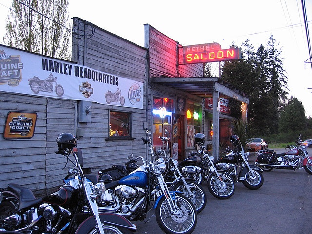 several motorcycles are parked in front of a restaurant