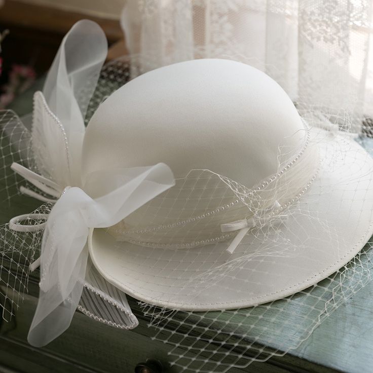 Vintage White Lace Pearl Wedding Hat Condition: Brand NewColor: WhiteSize: One Size(Diameter: about 56-58cm)Material:SatinsSuitable season: Spring/Summer/Autumn/ WinterPopular elements: Lace+PearlOccasion : Wedding/Birthday/Holiday/Anniversary Celebration/Anniversary CelebrationWhat is a Fascinator ?Fascinators have received a lot of attention since the Royal Wedding of Prince William to Catherine Middleton last spring. These not-quite-hats, not-quite-barrettes are a great way to make a statemen Fitted Elegant Bridal Accessories For Summer, Elegant Fitted Bridal Accessories For Summer, Elegant Fitted Summer Bridal Accessories, Fitted Cream Cloche Hat For Wedding, Brimmed Wedding Hats For Summer, Elegant Summer Ceremony Costume Hats And Headpieces, Fitted Cloche Mini Hat For Wedding, Elegant Spring Bridal Accessories For Ceremony, Fitted Bridal Accessories For Church