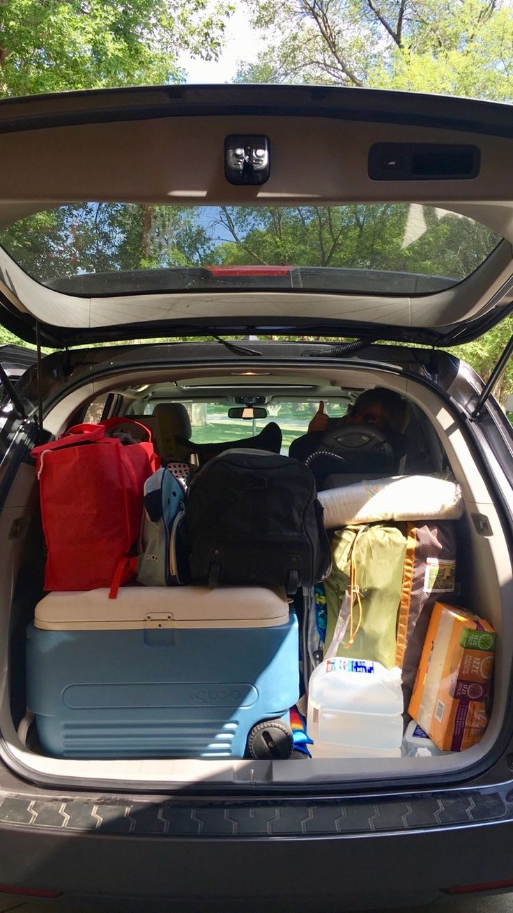 the back end of a car filled with luggage