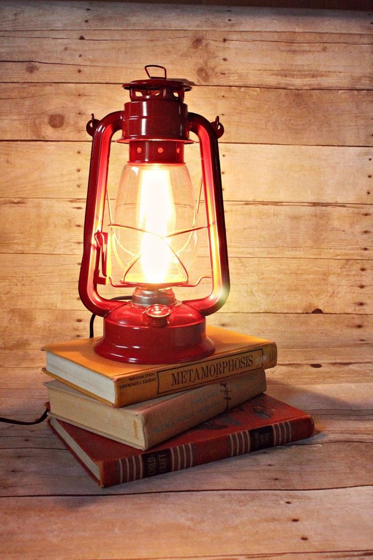 a red lantern sitting on top of two books