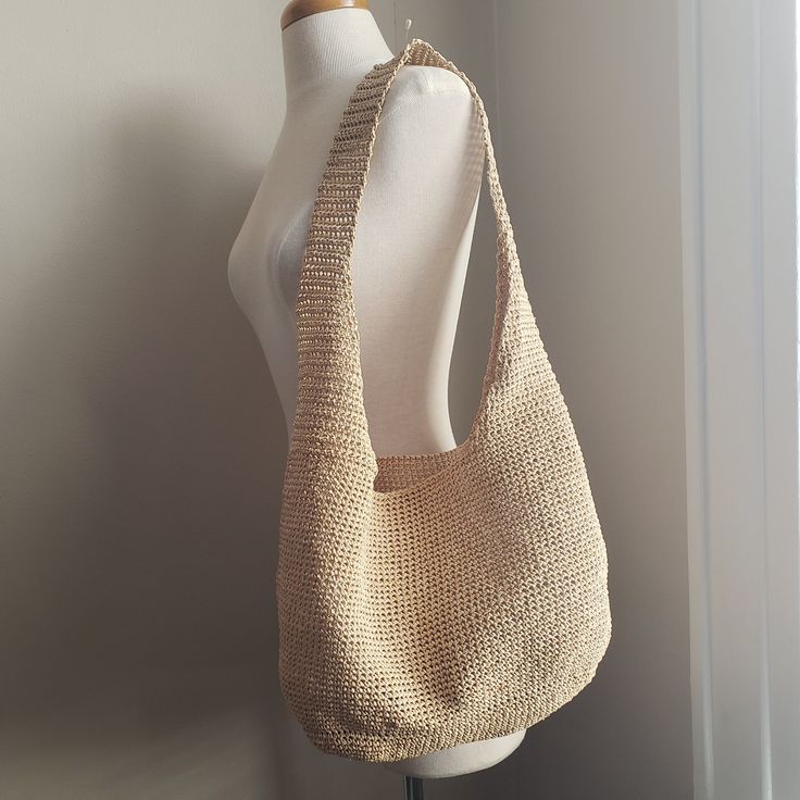 Stylish and simple designed crochet raffia bag for going to beaches, parks, towns ... everywhere in summer. Made with waterproofed paper raffia yarn.  It's soft, flexible, and strong! The color: Wheat beige ( the color of appearance depends on phones and PCs) Approximate measure  body: 15 inches (38 cm) x 9 inches (23 cm) bottom: 11 inches (28 cm) x  5 inches (12 cm) handle: 30 inches (76 cm) 100% paper raffia This yarn is waterproofed, but please avoid getting wet. Wipe clean No iron Cream Straw Crochet Summer Bag, Lightweight Cream Crochet Bag For Summer, Summer Everyday Hobo Bag In Natural Color, Cream Woven Hobo Bag For Vacation, Cream Hobo Shoulder Bag For Beach, Natural Hobo Bag For Everyday Summer Use, Eco-friendly Jute Hobo Bag For Summer, Eco-friendly Beige Hobo Bag For Spring, Eco-friendly Beige Hobo Bag For Vacation