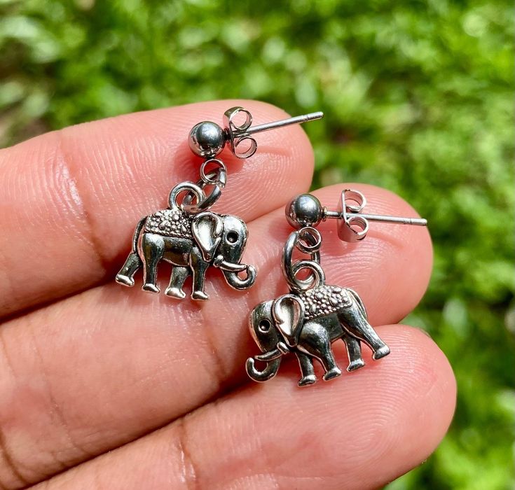 Small minimalist Elephant earrings *Made with high quality Alloy stainless steel charms with hypoallergenic stainless steel ear stud post *With proper care will last for years just store away in a jewelry box when not using and keep away from moisture *How to properly take care of your jewelry  1. Remove jewelry before showering or swimming, avoid any contact with water lotions or perfume  2. If your Jewelry starts to look dull just clean with white vinegar and fiber cloth 3. When not using keep Nickel-free Minimalist Surgical Steel Earrings, Minimalist Surgical Steel Earrings As Gift, Nickel-free Dangle Plug Earrings For Gift, Nickel-free Dangle Plug Earrings As Gift, Nickel Free Dangle Plug Earrings For Gift, Nickel-free Surgical Steel Earrings For Everyday, Nickel-free Surgical Steel Plug Earrings For Gift, Everyday Nickel-free Surgical Steel Earrings, Everyday Silver Surgical Steel Earrings