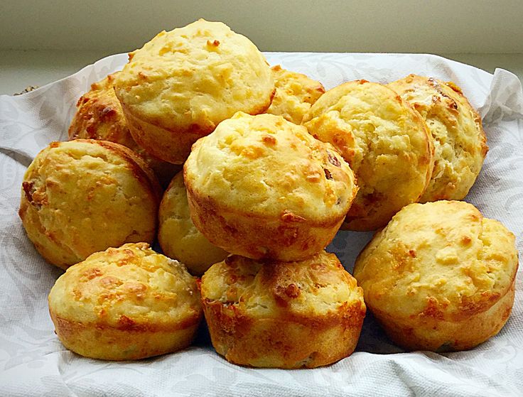 a pile of muffins sitting on top of a white napkin