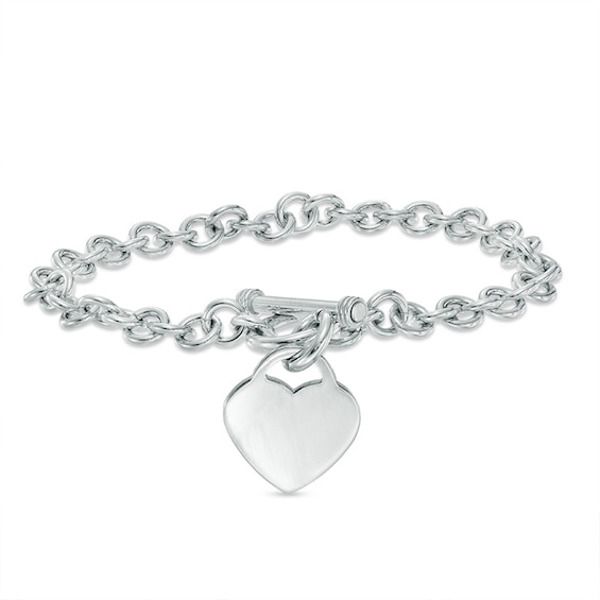 Simple, meaningful and so stylish, this darling heart charm bracelet is certain to win hers. Fashioned in sleek sterling silver, this rolo chain bracelet is finished with a lovely heart-shaped dangle charm. A look she'll treasure, this 7.25-inch bracelet is polished to a brilliant shine and secures with a toggle clasp. White Gold Classic Heart Charm Bracelet, Dainty Sterling Silver Charm Bracelet With Heart Charm, Classic White Gold Charm Bracelet With Heart, Elegant Everyday Sterling Silver Bracelet With Heart Charm, Classic White Gold Charm Bracelet With Heart Charm, Elegant Sterling Silver Bracelet With Heart Charm For Everyday, Sterling Silver Charm Bracelet With Heart Charm, Classic Sterling Silver Heart Charm Bracelet, Everyday Sterling Silver Charm Bracelet With Heart