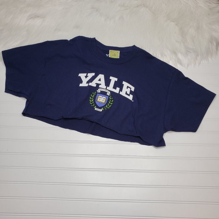 Yale University Shirt Women's Size Xl Crop Top Navy Blue Raw Edge New With Tags! Please Look At All Photos. Thanks! Flat Lay Measurements: Chest: 23.5" Length: 16" Blue Short Sleeve College Style Top, Blue Summer Shirt For College, Blue Spring College Tops, Blue Cotton College Style Tops, Blue Cotton Tops For College, Blue Spring Tops With School Spirit Style, Blue Graphic Print Top, Blue Tops For Spring School Spirit, Blue Spring Tops For School Spirit