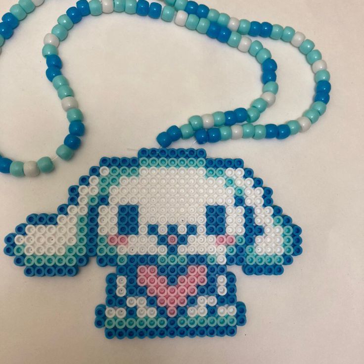 a beaded necklace with an image of the character stitched on it and beads