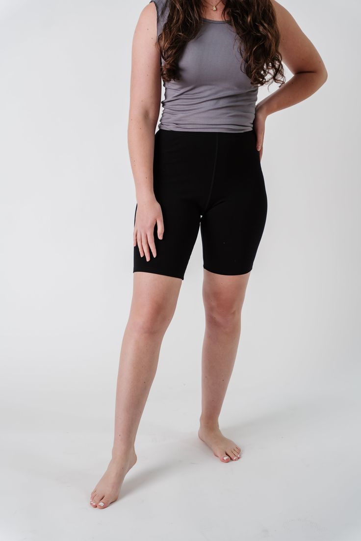 Looking for some extra coverage when wearing all your favorite skirts? Welcome the Bamboo Blend Biker Shorts! The high-rise waist features an elastic waistband to fit comfortably while you go about your day. High-quality, bamboo-blend fabric is lightweight and breathable for all weather conditions. Wear under all your favorite denim skirts and dresses for additional coverage! 90% Bamboo 10% Lycra Machine Wash Cold Hang to Dry Model Height 5'8" | Wearing Size Small Please carefully measure a simi Functional Bottoms With Elastic Waistband And Short Inseam, Functional Yoga Bottoms With Built-in Shorts, Athleisure Bottoms With Built-in Shorts, Athleisure Bottoms With 4-way Stretch, Compressive Functional Bottoms With Wide Waistband, Compression Bottoms With Built-in Shorts For Yoga, Versatile Mid-thigh Athletic Shorts With Built-in Shorts, Athleisure 4-way Stretch Shorts, Relaxed Fit Activewear With Short Inseam