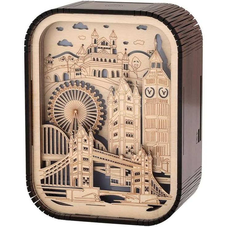 a wooden box with an image of the london eye and big ben on it's side