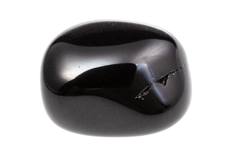 a close up of a shiny black object on a white background with room for text