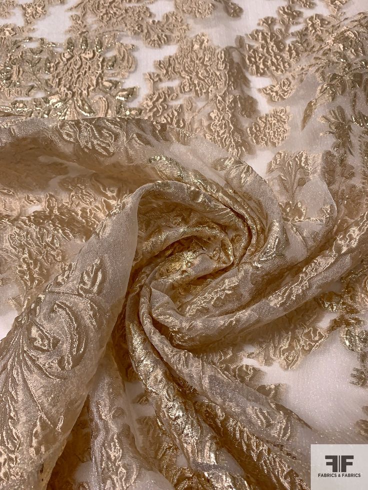 an image of a gold and white fabric