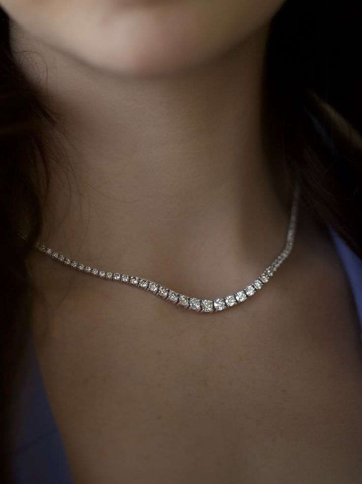 Nothing speaks luxury more than a diamond tennis necklace. The feeling of wearing a continuous strand of diamonds around your neck is immeasurable joy! Wear alone with a a stunning neckline on a special occaision or layered with gold necklaces on a random Tuesday for a luxe highstreet look. 7.81ctw of Natural SI/GHI brilliant Diamonds 14k White Gold 16" long with bracelet style double locking clasp Elegant Diamond Cut Crystal Tennis Necklace, Elegant Crystal Tennis Necklace For Formal Occasions, Dazzling Diamond White Single Strand Tennis Necklace, Dazzling Diamond White Single Strand Jewelry, Classic Crystal Tennis Necklace With Brilliant Cut, Classic Round Cut Crystal Tennis Necklace, Classic Diamond Cut Crystal Tennis Necklace, Timeless Single Strand Diamond White Jewelry, Dazzling Single Strand Diamond Jewelry