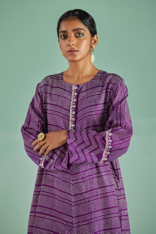 Purple straight kurta with geometric print. Paired with matching trouser.
Components: 2
Pattern: Print
Type Of Work: Geometric, Chevron
Neckline: Round Neck
Sleeve Type: Full Sleeves
Fabric: Kurta: Bamboo Silk, Trouser: Dull Bosky
Color: Purple
Other Details: 
Length: 
Kurta: 48 inches
Trouser: 36 inches
Occasion: Puja - Aza Fashions Festive Ikat Print Straight Kurta Sets, Designer Wear Block Print Sets For Eid, Block Print Designer Sets For Eid, Designer Block Print Sets For Eid, Festive Printed Motifs Pant Set For Eid, Designer Long Sleeve Pant Set With Printed Motifs, Eid Ikat Print Long Sleeve Sets, Festive Ikat Print Sets With Long Sleeves, Ikat Print Long Sleeve Sets For Eid