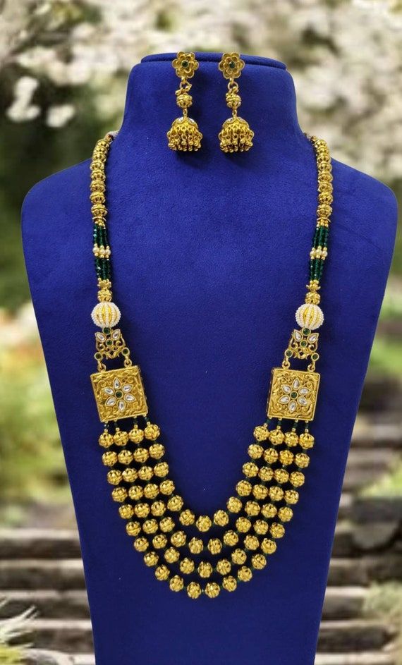 Check out this item in my Etsy shop https://www.etsy.com/listing/1363395873/gold-mala-indian-long-necklace-indian Gold-plated Jewelry With Zari Work, Gold Plated Jewelry With Zari Work, Gold Chandbali Beaded Necklaces For Wedding, Gold Chandbali Beaded Necklace For Wedding, Green Gold Plated Bollywood Necklace, 22k Gold Jewelry With Zari Work, Bollywood Style Green Gold-plated Necklace, Gold Kundan Chandbali Beaded Necklaces, Gold Jewelry With Zari Work For Festivals