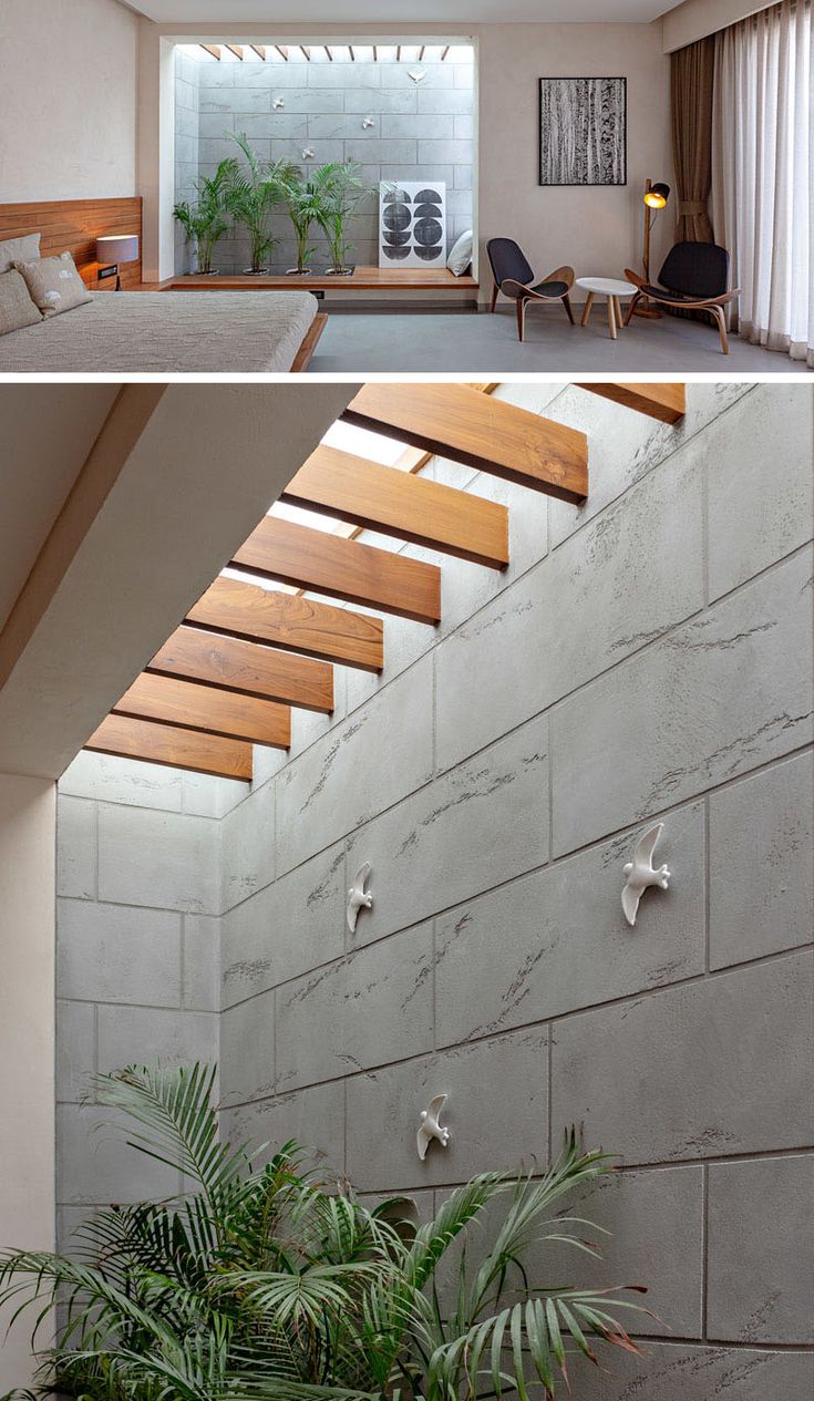 this modern house has an open floor plan and is made up of concrete blocks with wooden slats on the ceiling