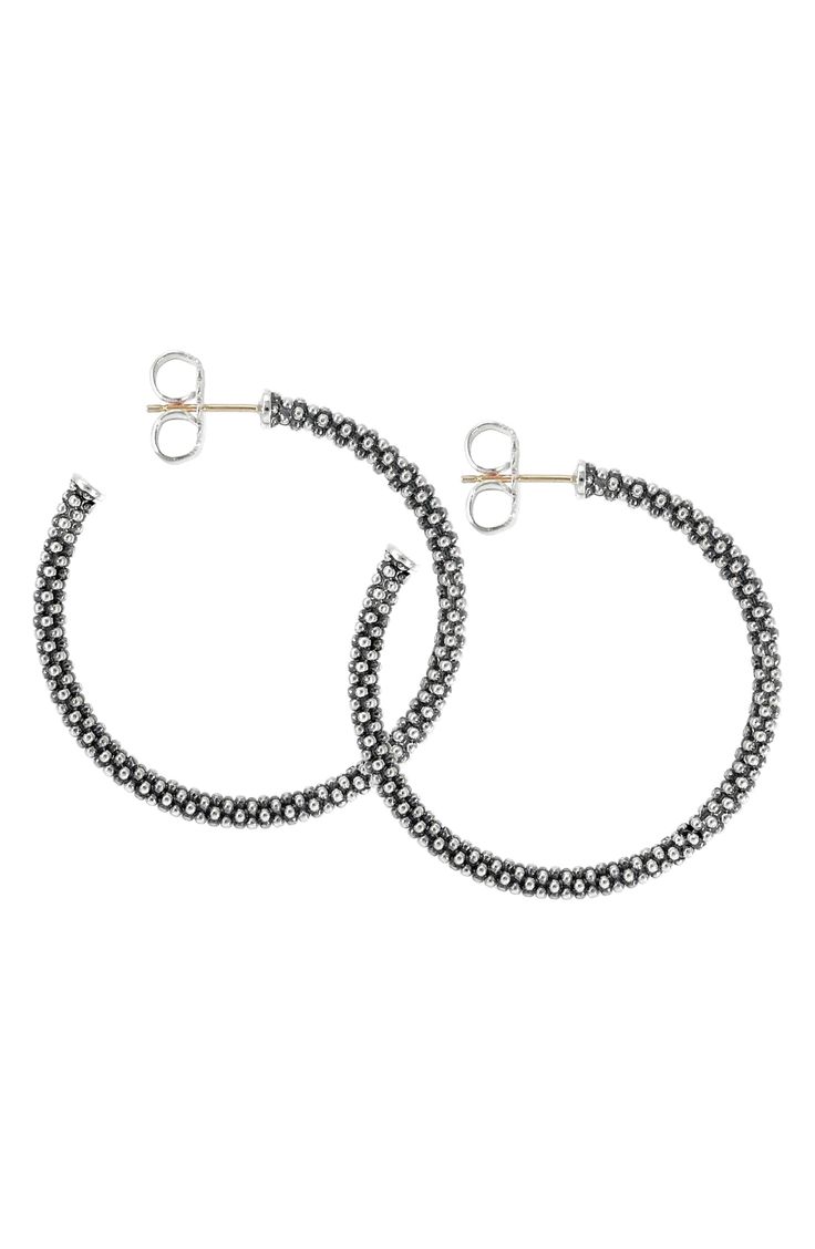 Caviar beading defines a sophisticated pair of hoop earrings cut from brilliant sterling silver. Style Name:Lagos Medium Caviar Hoop Earrings. Style Number: 254835. Available in stores. Small Hoop Sterling Silver Jewelry With Diamond Cut, Sterling Silver Hoop Jewelry With Diamond Cut, Elegant Round Hoop Earrings With Oxidized Finish, Elegant Beaded Sterling Silver Hoop Earrings, Sterling Silver Oxidized Hoop Earrings, Sterling Silver Hoop Earrings With Oxidized Finish, Silver Beaded Hoop Earrings In Sterling Silver, Silver Sterling Beaded Hoop Earrings, Silver Beaded Sterling Silver Hoop Earrings